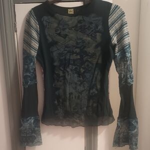 Blue long sleeve fitted top with crew neck and asymmetrical style features